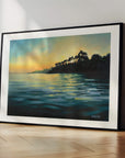 Paved In Light No.1, framed landscape prints in black wood ready hang of Cornish Helford River at sunset over water, a calming artwork by British artist Rachel Painter