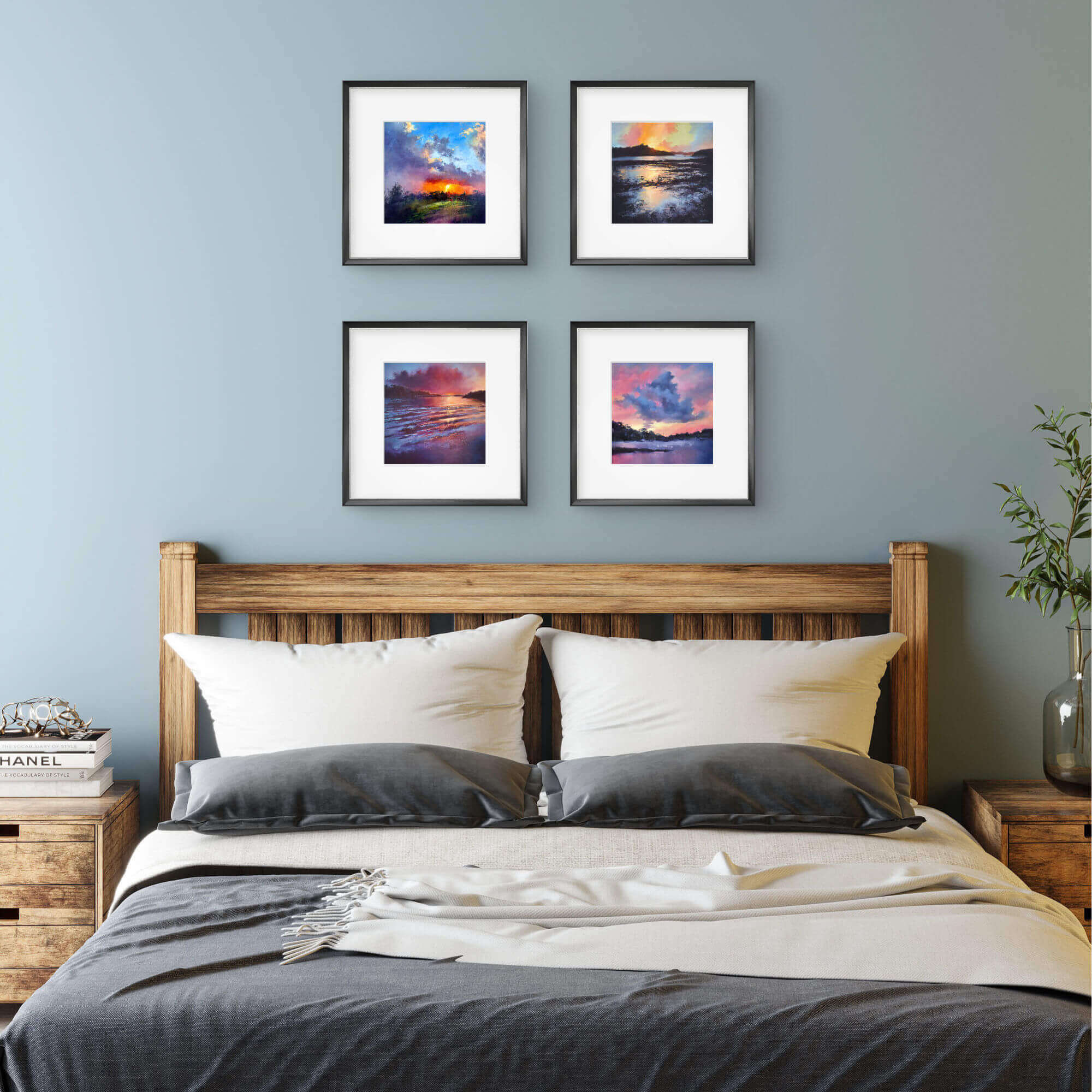 Bedroom with wooden headboard and four framed sunset landscape pictures on the wall.