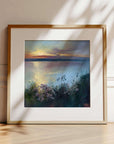 Scatter The Seeds Of Your Dreams No.3,  a clifftop view with flowers at sunset, framed artwork in oak ready to hang - prints of Cornwall Porthtowan beach at sunset by Cornish artist Rachel Painter