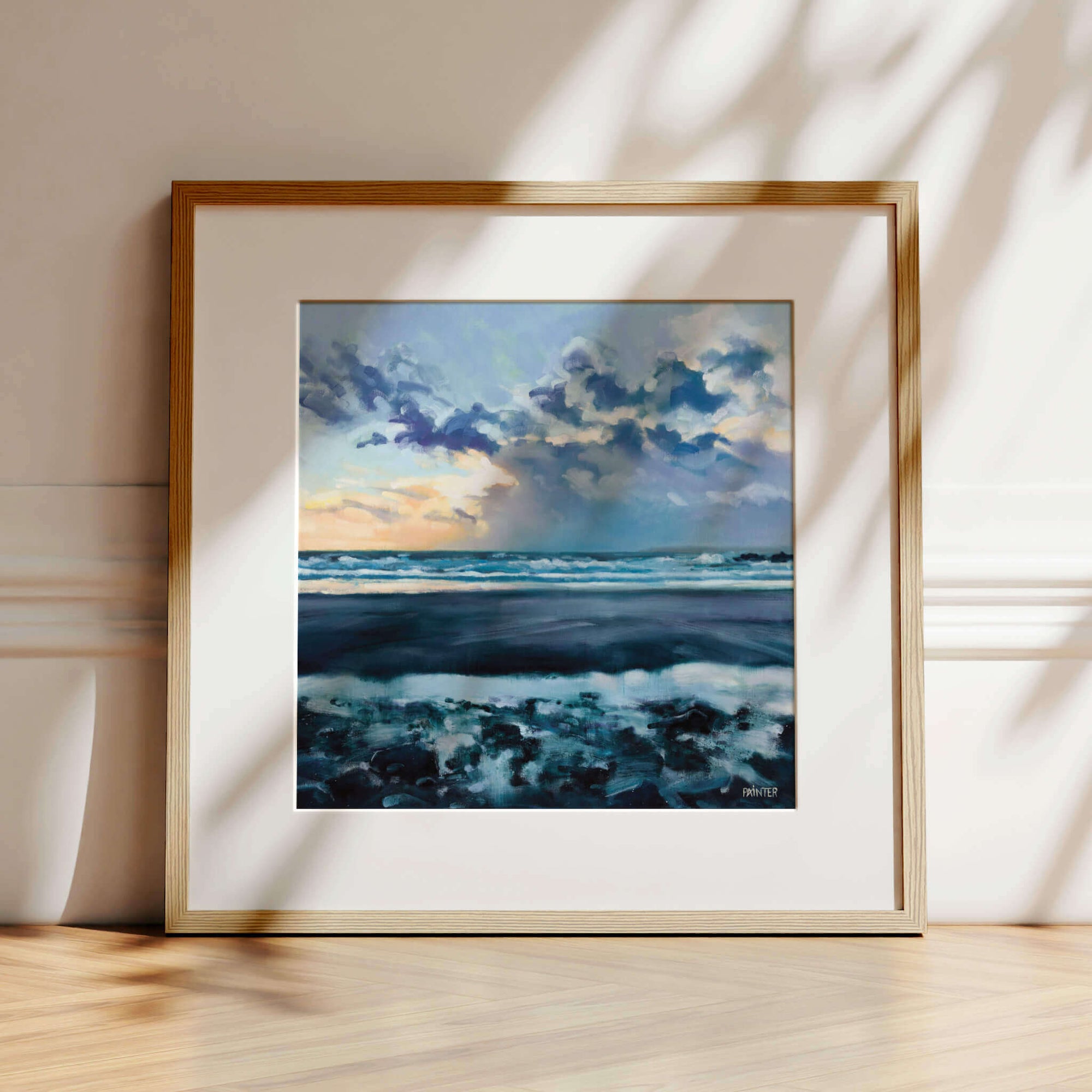 Towards The Light, a dramatic sunset beach framed artwork in oak ready to hang of Perranuthnoe beach - prints of Cornwall by Cornish artist Rachel Painter