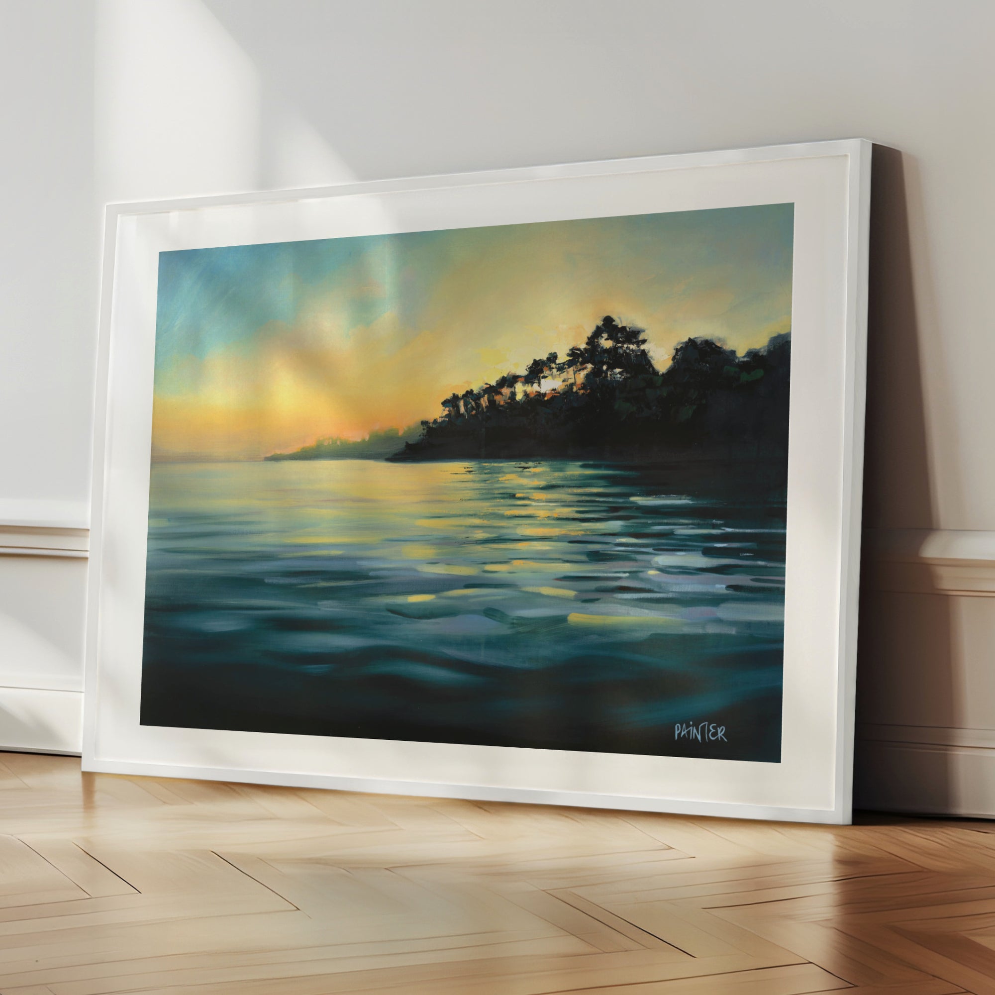 Paved In Light No.1, white framed coastal art prints of glowing sunset with trees reflecting on water on the Helford River by Cornwall artist Rachel Painter