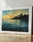 Paved In Light No.1, white framed coastal art prints of glowing sunset with trees reflecting on water on the Helford River by Cornwall artist Rachel Painter