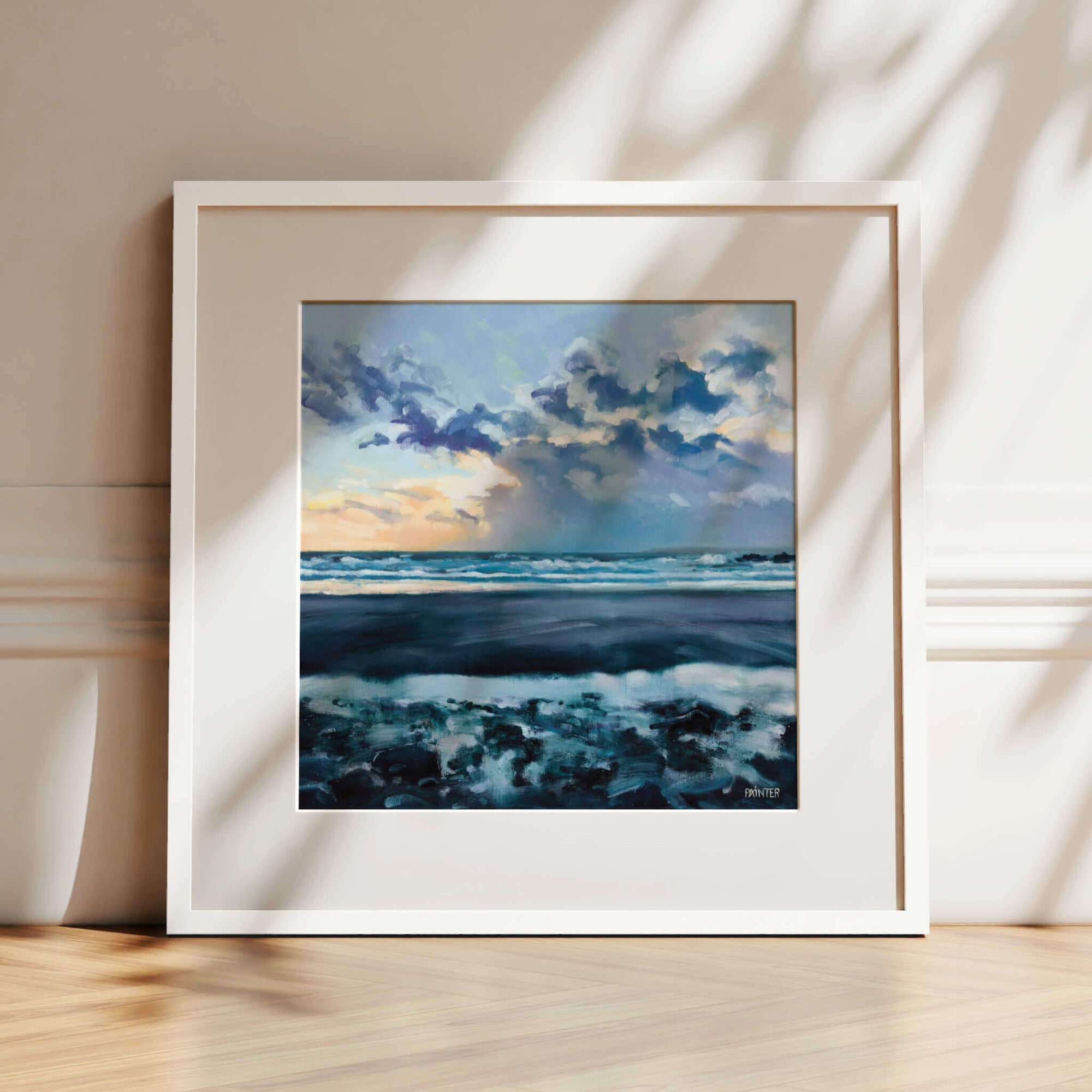 Towards The Light, white framed coastal art prints of of glowing sunset over the waves at Perranuthnoe beach by Cornwall artist Rachel Painter