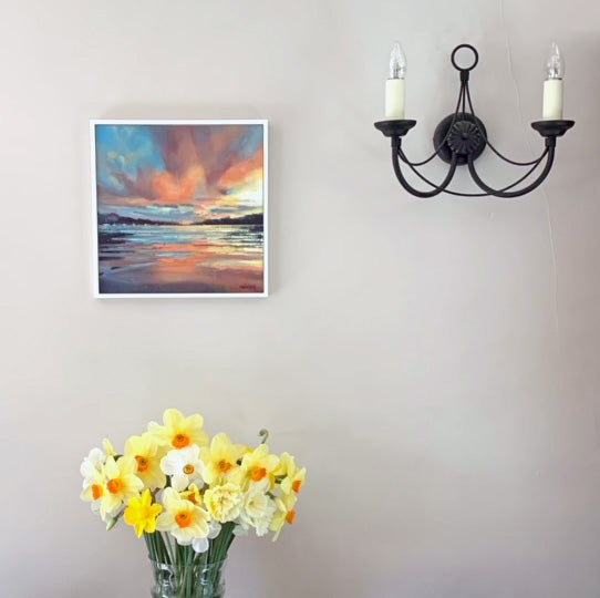 Shimmering sunset oil painting framed in white