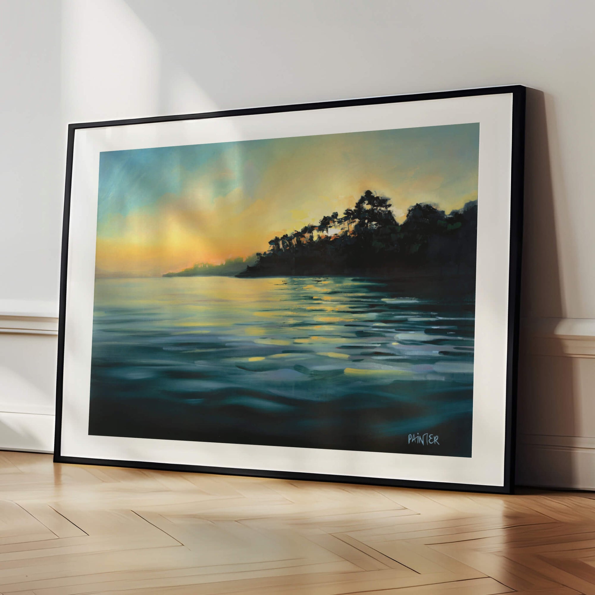 Paved In Light No.1, framed landscape prints in black wood ready hang of Cornish Helford River at sunset over water, a calming artwork by British artist Rachel Painter