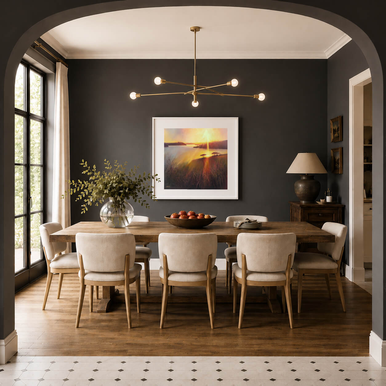 Large contemporary landscape fine art print featuring a dramatic colourful sunset, styled as statement wall art in an elegant dining room interior with deep charcoal walls. By landscape painter, Rachel Painter, the view is inspired by a view looking up the Helford River estuary in Cornwall on a summers evening. 