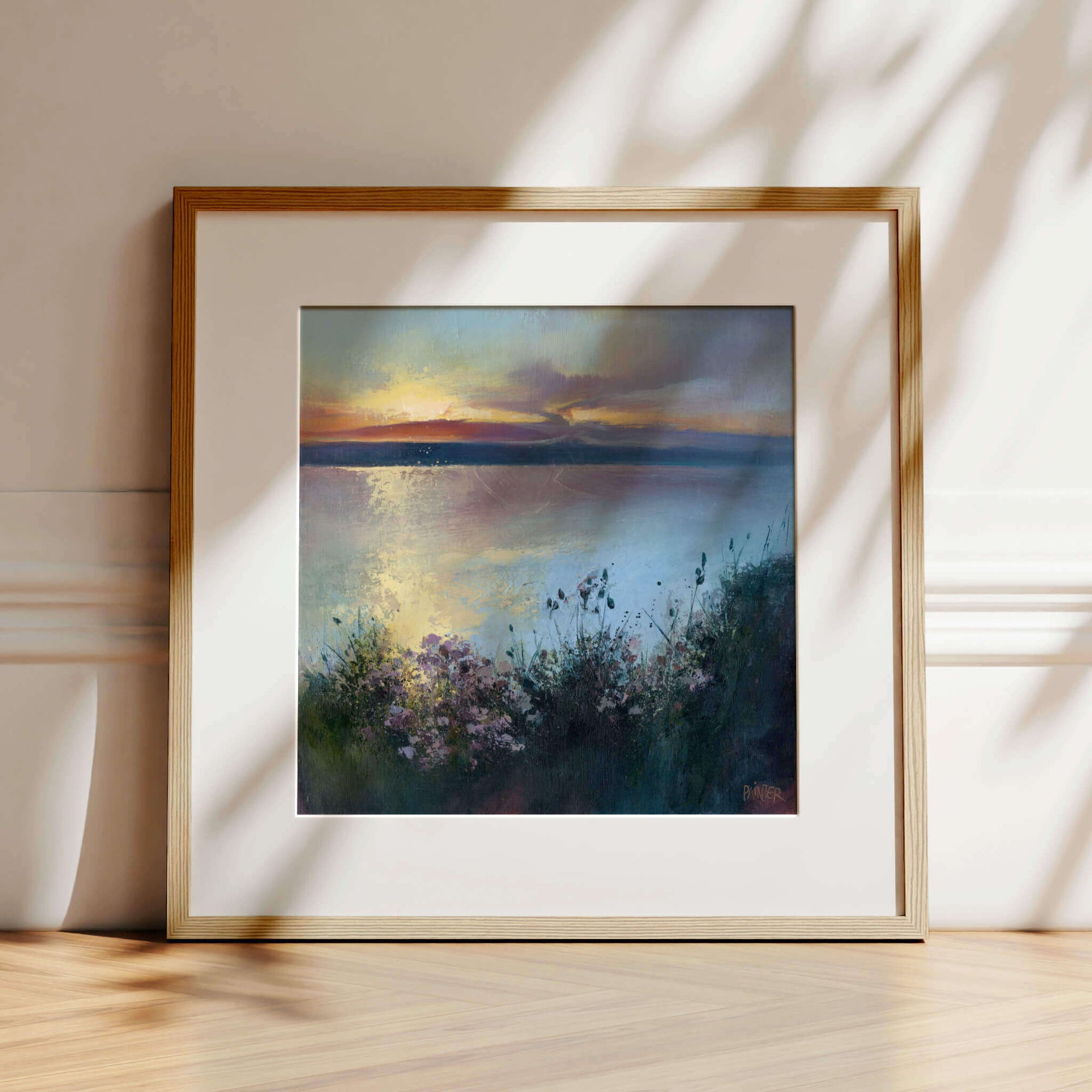 Scatter The Seeds Of Your Dreams No.3,  a clifftop view with flowers at sunset, framed artwork in oak ready to hang - prints of Cornwall Porthtowan beach at sunset by Cornish artist Rachel Painter