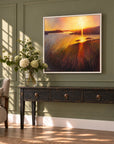 Colourful original sunset landscape painting by Rachel Painter displayed in a light-filled living room with olive green walls.