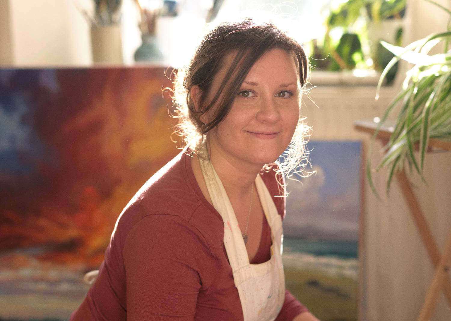 Rachel Painter in her studio painting for a  wedding commission 